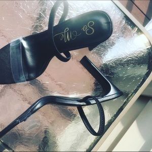 Women’s black sandal with clear strap